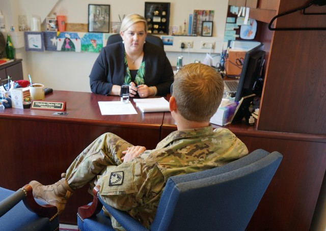 Virginia Claire Nist, chief of client services, Ansbach Law Center, assists a client with notary services on June 23, 2021. The Ansbach Law Center Legal Assistance Office was recognized June 10 with the 2020 Chief of Staff Award for Excellence in Legal Assistance Active Army – Small Office award with 3 other offices across the Army. The office was also recognized with this award in 2019.