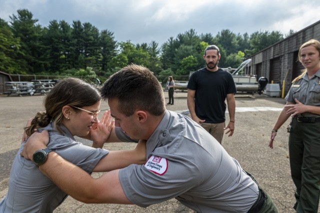 Hannah Keppler fends off Matthew Balas, park rangers with the U.S. Army Corps of Engineers Pittsburgh District, during a training session on self-defense tactics at Crooked Creek Lake in Ford City, Pennsylvania, June 15, 2021, as part of a...