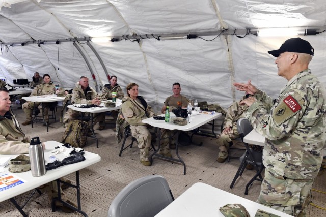 Col. Roberto Marin, Chief, Materiel Test and Evaluation Branch, USAMTEAC, briefs test players following a test of the ROCS auto-injector.