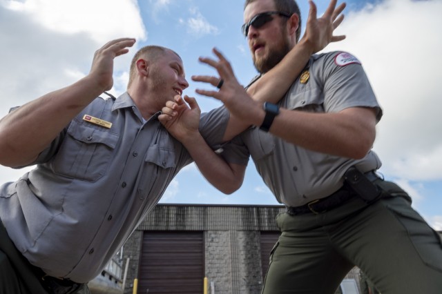 Andrew Schwab and Kyle Toms, park rangers from the U.S. Army Corps of Engineers Pittsburgh District train on self-defense tactics at Crooked Creek Lake in Ford City, Pennsylvania, June 15, 2021, as part of a five-day Visitor Assistance course....