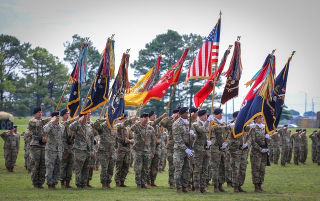 Unit commanders and colour bearers salute during a change of command ceremony for the 3rd Brigade Combat Team, 101st Airborne Division (Air Assault), on Fort Campbell, KY June 18, 2021.
 
The unit colours is passed during a ceremony which symbolizes the transfer of command responsibility and authority from the old commander to the new commander. (U.S. Army photo by: Staff Sgt. Michael Eaddy)