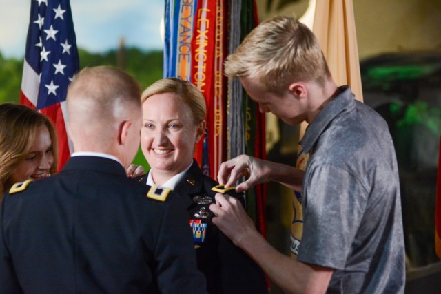 Family members of Brig. Gen. Michelle K. Donahue, 56th Quartermaster General, pin on the rank of brigadier general during a promotion ceremony June 21 at the Army Women’s Museum at Fort Lee.