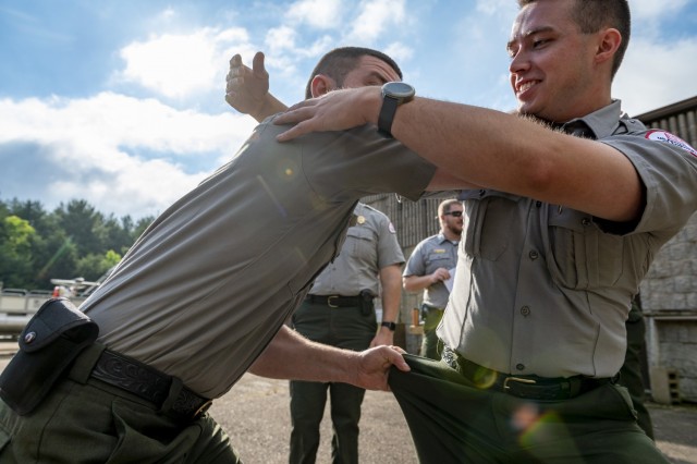 Vincent Klinkner and Matthew Balas, park rangers for the U.S. Army Corps of Engineers Pittsburgh District, train on self-defense tactics at Crooked Creek Lake in Ford City, Pennsylvania, June 15, 2021, as part of a five-day Visitor Assistance...