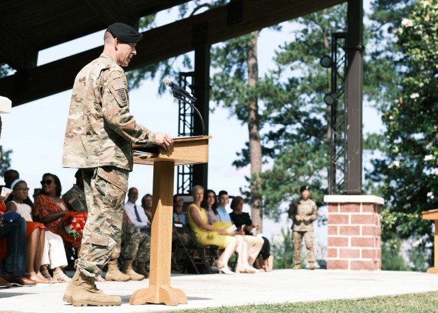 Col. Jeremy St. Laurent addresses the guests at the 597th Transportation Bde.Change of Command Ceremony at Magnolia Park, Fort Eustis, Va. June 25.