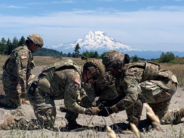 Engineer Advisors from Teams 5520 and 5521, 5th Battalion, 5th Security Force Assistance Brigade assist members of the 17th Fires Brigade&#39;s ammunition and distribution platoons during demolition training, June 22, 2021 at Joint Base Lewis McChord, Washington. Today, the battalion came under the command of Lt. Col. Meghann Sullivan, a graduate of the Army&#39;s prestigious School of Advanced Military Studies.