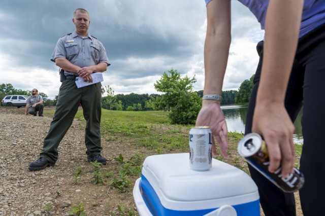 Andrew Schwab, park ranger for the U.S. Army Corps of Engineers Pittsburgh District, responds to a training scenario involving a disorderly visitor consuming alcohol and littering at Crooked Creek Lake in Ford City, Pennsylvania, June 15, 2021, as...