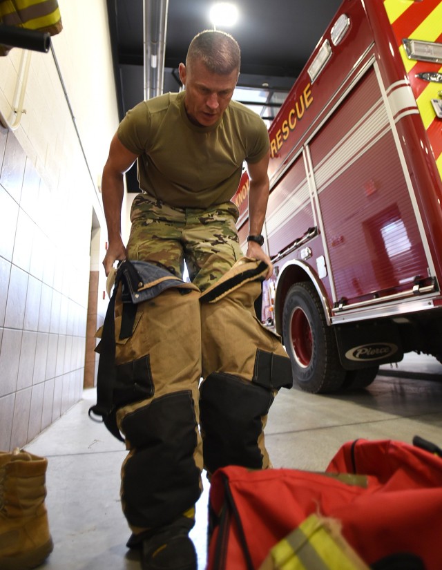 Fort Knox Garrison Commander Col. CJ King dons firefighting gear Oct. 9, 2019, to participate in annual firefighting training that has been hosted by Fort Knox Fire for the last 10 years. He and other leaders rode on firetrucks to the scene of a...