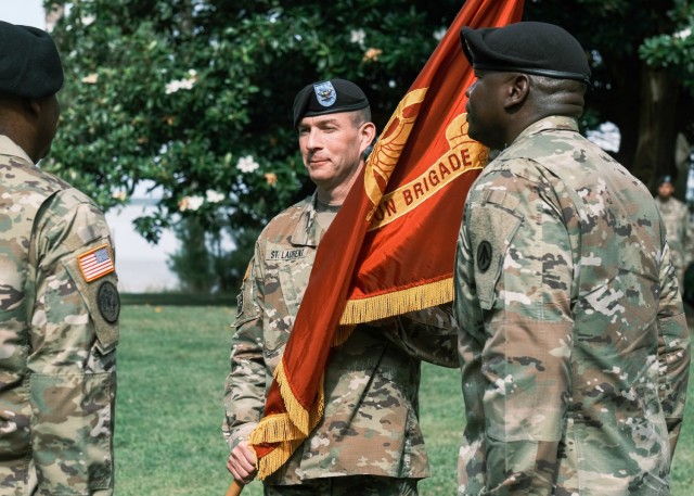 Col. Jeremy St. Laurent, commander, 597th Transportation Bde., holds the colors during a Change of Command Ceremony at Magnolia Park, Fort Eustis, Va. June 25.