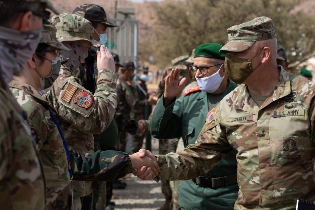 U.S. Army Maj. Gen. Michael Turley, Adjutant General Utah National Guard, shakes hands with a Royal Moroccan Armed Forces member during a key leader engagement as part of African Lion 2021 June 16, 2021, at the Military Medical Surgical Field...