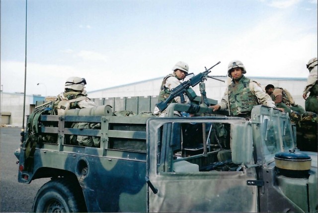 Soldiers of the HHB 108th Brigade Air Defense Artillery (ADA) LOGPAX Security
Team charged up in Kuwait before heading up north to provide security to two flatbeds containing supplies for the Patriot missile system during OEF/OIF - 2003
