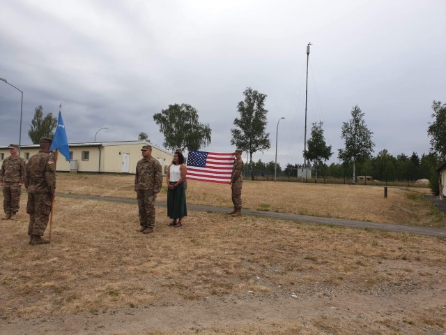 WO1 William David Grevel standing - front and center, awaiting his Commander to promote him to CW2 in Camp Hohenfels, Germany. His sister – Aylamarie Grevel, standing behind him, is a QASAS assigned to the Hohenfels Ammunition Supply Point under the 21st TSC, Kaiserslautern, Germany. She help pin her brother during his promotion. 