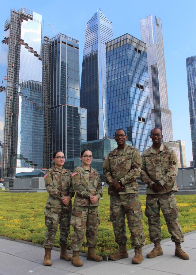 New York Army National Guard Spcs. Armani and Artez Wilkins, right, and Pfcs. Jiralmi and Gizelle Lugo, left, on the roof of the Jacob Javits Mass vaccination site in New York June 29, 2021. The two sets of identical twins have served together to...