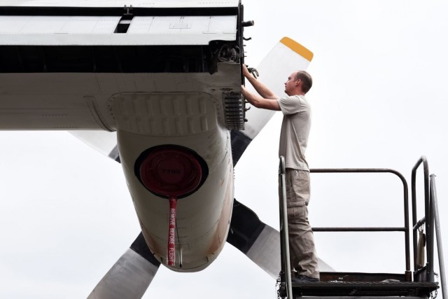 U.S. Air Force Senior Airman Joseph Mathiesen, 62nd Aircraft Maintenance Squadron crew chief, works on a C-130E Hercules at Joint Base Lewis-McChord, Washington, June 13, 2021. The 62nd AMXS worked alongside several other units in order to...