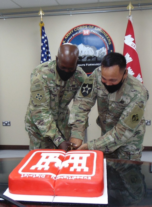First “official” duty of the new command team of Reed and Tomagan was cutting the ceremonial cake following the Change of Responsibility, Change of Command ceremony on June 28, 2021 at Camp Arifjan, Kuwait. (Photo by Cecilia Polanco)