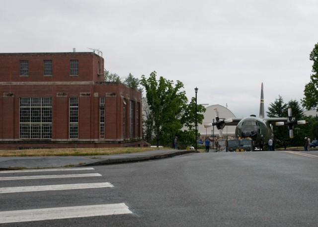 A C-130E Hercules navigates the street at Joint Base Lewis-McChord, Washington, June 13, 2021. The 62nd Aircraft Maintenance Squadron worked alongside several other units in order to coordinate and carry out the successful removal of the C-130’s...