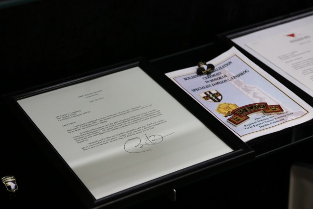 A condolence letter from former President Barack Obama to Mr. Curtis Lindskog rests in the glass display case memorial, inside Spc. Jameson L. Lindskog U.S. Army Reserve Center after a memorialization ceremony June 29, 2021 at Parks Reserve Forces Training Area in Dublin, Calif. Lindskog, a resident of Pleasanton, Calif., was killed in action March 29, 2011 while serving as a combat medic with the 2nd Battalion, 327th Infantry Regiment, 1st Brigade Combat Team, 101st Airborne Division in Afghanistan. He posthumously received the Silver Star for his heroic actions that day.
(Photo by Sgt. 1st Class Matthew Chlosta)