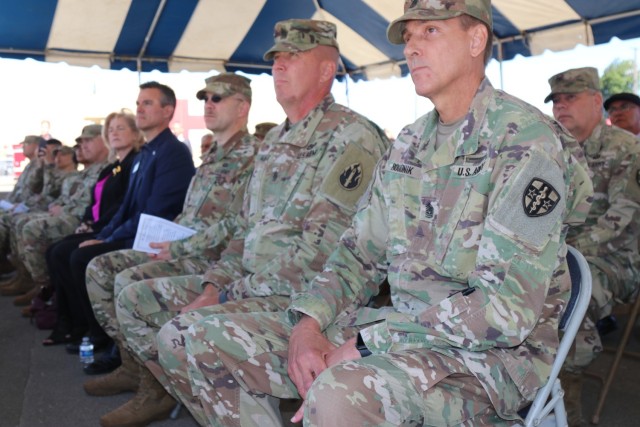 Center, Command Sgt. Maj. Patrick McKie, senior enlisted leader, 63rd Readiness Division and Command Sgt. Maj. Robert Boudnik, senior enlisted leader, Army Reserve Medical Command listen to a speaker during the Spc. Jameson L. Lindskog U.S. Army Reserve Center memorialization ceremony June 29, 2021 at Parks Reserve Forces Training Area in Dublin, Calif. Lindskog, a resident of Pleasanton, Calif., was killed in action March 29, 2011 while serving as a combat medic with the 2nd Battalion, 327th Infantry Regiment, 1st Brigade Combat Team, 101st Airborne Division in Afghanistan. He posthumously received the Silver Star for his heroic actions that day.
(Photo by Sgt. 1st Class Matthew Chlosta)