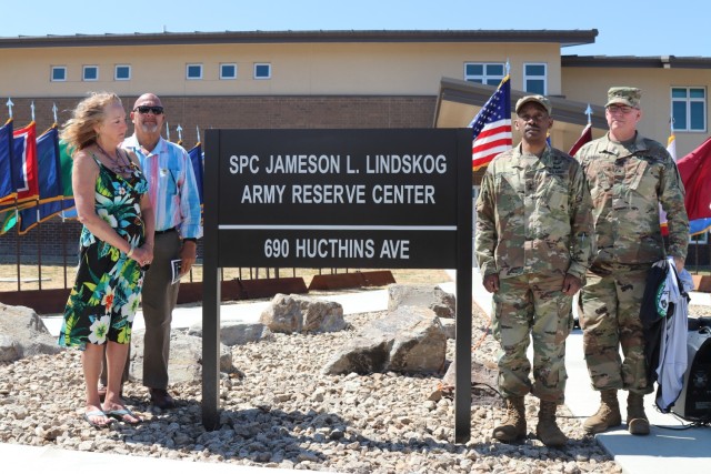 During the Spc. Jameson L. Lindskog U.S. Army Reserve Center memorialization ceremony, from left to right, Mrs. Jo Lindskog, Lindskog’s stepmother, looks at the just unveiled plaque as her and Mr. Curtis Lindskog, Lindskog’s father; Maj. Gen. Jonathan Woodson, commanding general, Army Reserve Medical Command and Brig. Gen. Joseph Marsiglia, commanding general, Army Reserve Medical Readiness and Training Command listen to the reading of the Army Reserve Center dedication by Mr. Doug Miller, the master of ceremony, June 29, 2021 at Parks Reserve Forces Training Area in Dublin, Calif. Lindskog, a resident of Pleasanton, Calif., was killed in action March 29, 2011 while serving as a combat medic with the 2nd Battalion, 327th Infantry Regiment, 1st Brigade Combat Team, 101st Airborne Division in Afghanistan. He posthumously received the Silver Star for his heroic actions that day.
(Photo by Sgt. 1st Class Matthew Chlosta)   