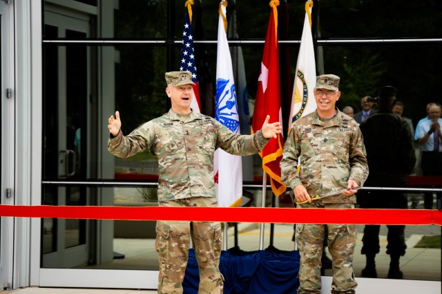 U.S. Army Aviation and Missile Command Commander Maj. Gen. Todd Royar (left), and AMCOM Command Sergeant Maj. Mike Dove, speak at a ceremony to reopen the newly renovated Maj. Gen. John M. Cone Metrology Laboratory June 29 at Redstone Arsenal, Ala.