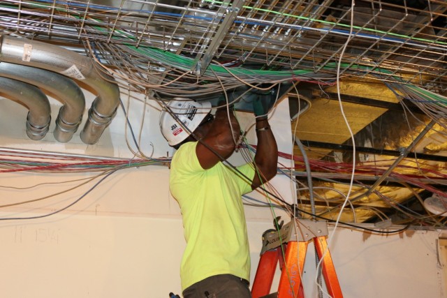 An electrician runs new power lines to the added calibration areas in the Army Primary Standards Laboratory on Redstone Arsenal, Alabama. The lab is receiving a top-to-bottom, $32 million renovation which includes all new utilities and...
