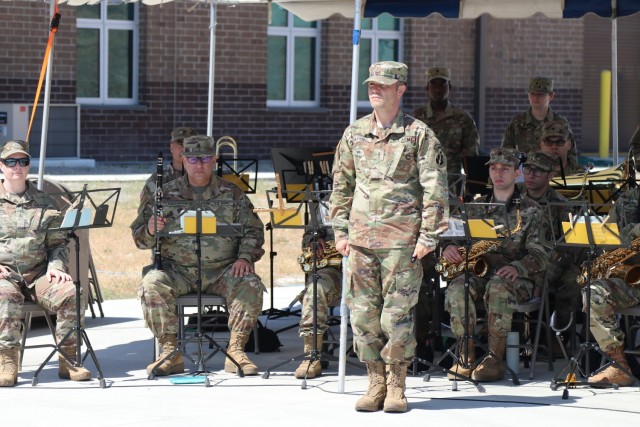 Center, Chief Warrant Officer 3 Jeremy Garrido, commander, 191st Army Band, 63rd Readiness Division stands at the position of attention during the Spc. Jameson L. Lindskog U.S. Army Reserve Center memorialization ceremony June 29, 2021 at Parks Reserve Forces Training Area in Dublin, Calif. Lindskog, a resident of Pleasanton, Calif., was killed in action March 29, 2011 while serving as a combat medic with the 2nd Battalion, 327th Infantry Regiment, 1st Brigade Combat Team, 101st Airborne Division in Afghanistan. He posthumously received the Silver Star for his heroic actions that day.
(Photo by Sgt. 1st Class Matthew Chlosta)