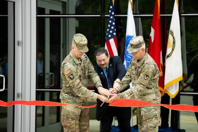U.S. Army Aviation and Missile Command Commander Maj. Gen. Todd Royar (left), Director of the U.S. Army Test, Measurement, and Diagnostic Equipment Activity Dr. Richard Parker, and AMCOM Command Sergeant Maj. Mike Dove, cut a ribbon to reopen the...