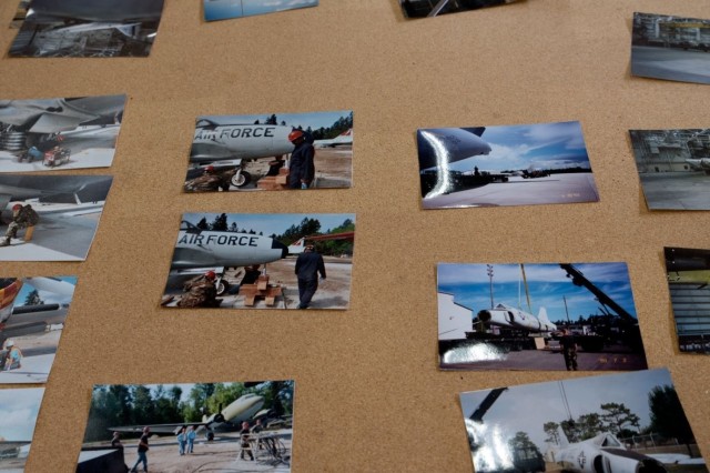 Photos of prior aircraft restoration projects are displayed on a board at Joint Base Lewis-McChord, Washington, June 13, 2021. The McChord Air Museum worked alongside many 62nd Airlift Wing units and volunteers to restore and display a C-130E...