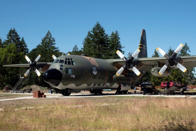 The 62nd Aircraft Maintenance Squadron, along with several other Team McChord units, towed a C-130E Hercules to its display area on Heritage Hill at Joint Base Lewis-McChord, Washington, June 23, 2021. The units worked together in order to...