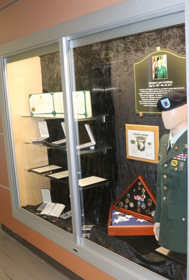 A memoriam flag box sits in the glass display case memorial, inside Spc. Jameson L. Lindskog U.S. Army Reserve Center after a memorialization ceremony June 29, 2021 at Parks Reserve Forces Training Area in Dublin, Calif. Lindskog, a resident of Pleasanton, Calif., was killed in action March 29, 2011 while serving as a combat medic with the 2nd Battalion, 327th Infantry Regiment, 1st Brigade Combat Team, 101st Airborne Division in Afghanistan. He posthumously received the Silver Star for his heroic actions that day.
(Photo by Sgt. 1st Class Matthew Chlosta)