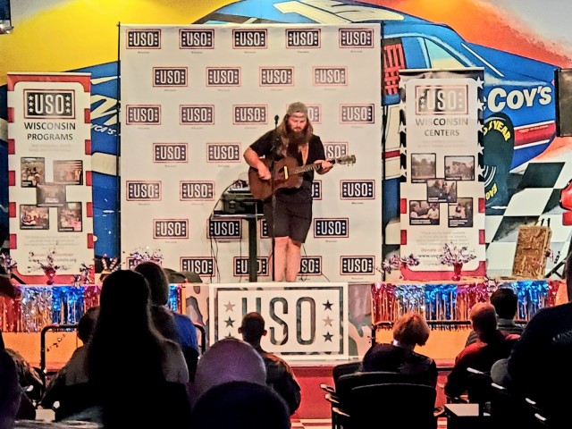Artist Chris Kroeze sings a song June 15, 2021, during his 90-minute concert at Fort McCoy, Wis. He entertained dozens of audience members in McCoy's Community Center during a concert that was organized by Wisconsin USO and supported by the Fort...