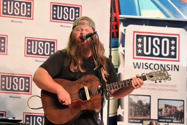 Artist Chris Kroeze sings a song June 15, 2021, during his 90-minute concert at Fort McCoy, Wis. He entertained dozens of audience members in McCoy's Community Center during a concert that was organized by Wisconsin USO and supported by the Fort...