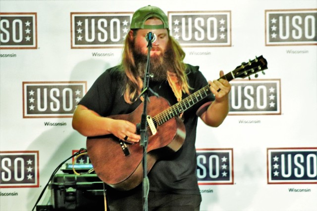 Artist Chris Kroeze sings a song June 15, 2021, during his 90-minute concert at Fort McCoy, Wis. He entertained dozens of audience members in McCoy's Community Center during a concert that was organized by Wisconsin USO and supported by the Fort...