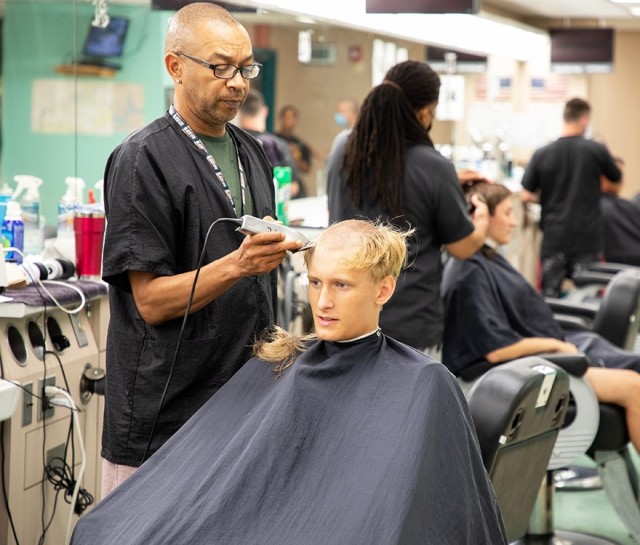 A new cadet receives his first of many haircuts at the U.S. Military Academy at West Point during Reception Day June 28, 2021. More than 1,200 new cadets will undergo administrative processing, are fitted with their initial military clothing...