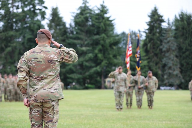 Col. Jonathan Chung renders a salute to 5th Security Force Assistance Brigade Command Sgt. Maj. Rob Craven at Joint Base Lewis McChord, Washington, June 30, 2021 during the 5th SFAB&#39;s Assumption of Command Ceremony.