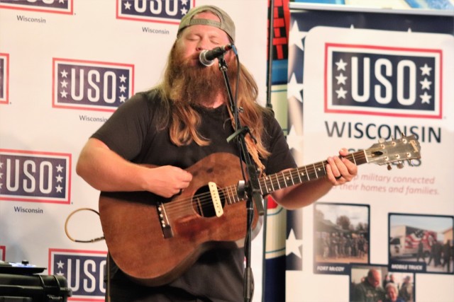 Artist Chris Kroeze sings a song June 15, 2021, during his 90-minute concert at Fort McCoy, Wis. He entertained dozens of audience members in McCoy's Community Center during a concert that was organized by Wisconsin USO and supported by the Fort...