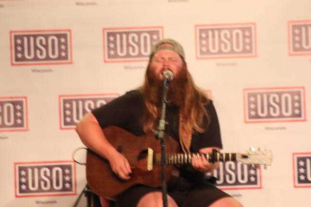 Entertainer and musician Chris Kroeze sings a song June 15, 2021, during his 90-minute concert at Fort McCoy, Wis. He entertained dozens of audience members in McCoy's Community Center during a concert that was organized by Wisconsin USO and...