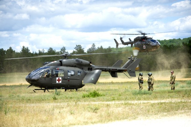 Military and civilian first responders work together during a simulated medical evacuation scenario June 16, 2021, during the National Guard Patriot '21 exercise at Fort McCoy, Wis. Patriot ‘21 was a joint, interagency exercise sponsored by the...