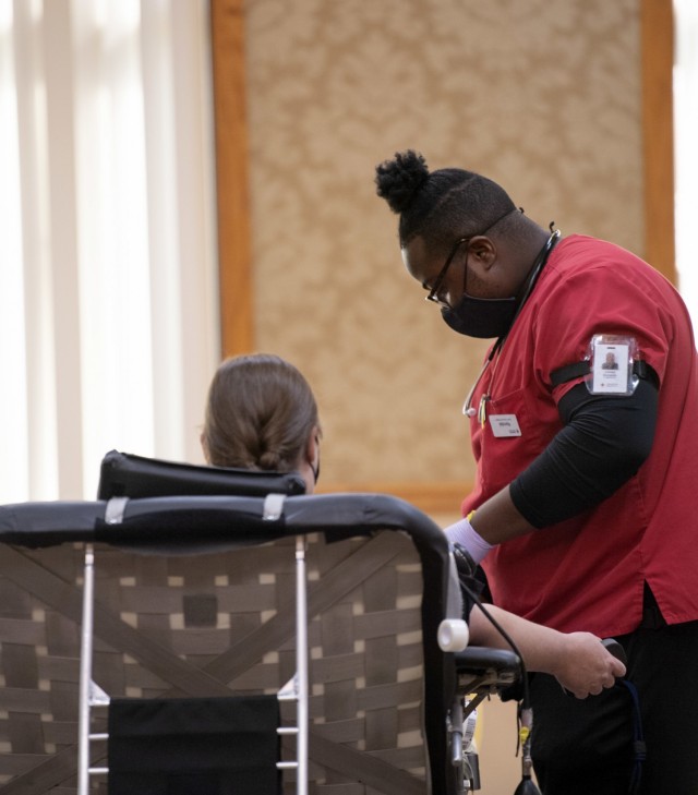 Kendal Benjamin, a volunteer with the American Red Cross takes a donation from a member of the Fort Jackson community June 28 during a blood drive at the NCO Club.