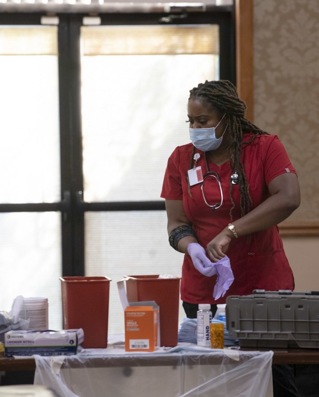 An American Red Cross volunteer prepares to take blood donations during a Community Blood Drive June 28 at the NCO Club.  Community blood drives are held every quarter on Fort Jackson.