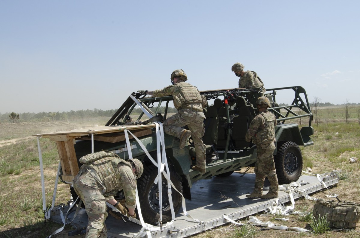 <em>Paratroopers of 2-325 IN de-rig the ISV on Holland Drop Zone (U.S. Army)</em>