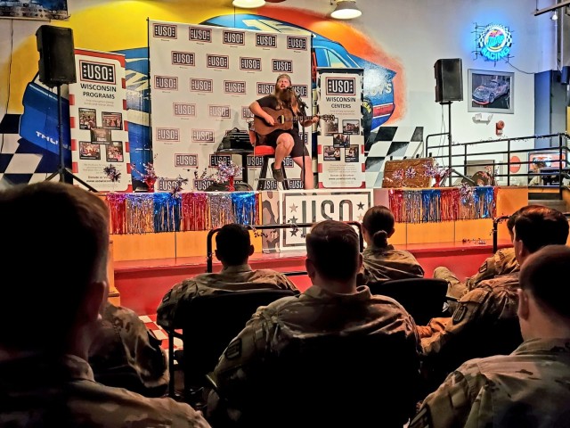Artist Chris Kroeze sings a song June 15, 2021, during his 90-minute concert at Fort McCoy, Wis. He entertained dozens of audience members in McCoy's Community Center during a concert that was organized by Wisconsin USO and supported by the Fort...