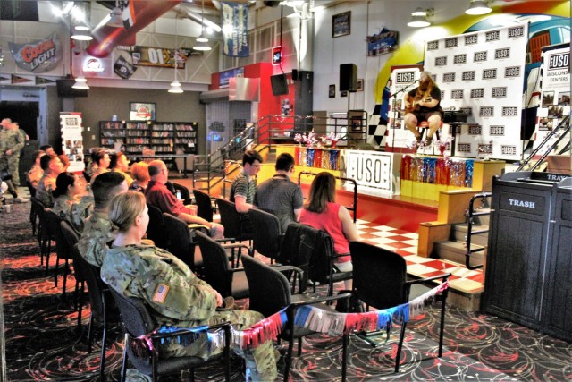 Artist Chris Kroeze sings a song June 15, 2021, during his 90-minute concert at Fort McCoy, Wis. He entertained dozens of audience members in McCoy's Community Center during a concert that was organized by Wisconsin USO and supported by the Fort...