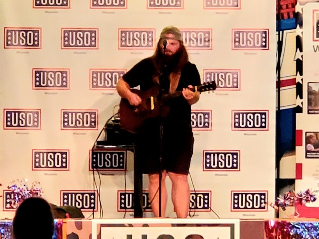 Artist Chris Kroeze sings a song June 15, 2021, during his 90-minute concert at Fort McCoy, Wis. He entertained dozens of audience members in McCoy's Community Center during a concert that was organized by Wisconsin USO and supported by the Fort...