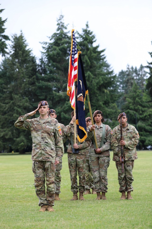 The 5th Security Force Assistance Brigade Executive Officer, Maj. Paul Brown renders a salute as commander of troops during the 5th SFAB's Assumption of Command ceremony at Joint Base Lewis McChord, Washington, June 30, 2021.