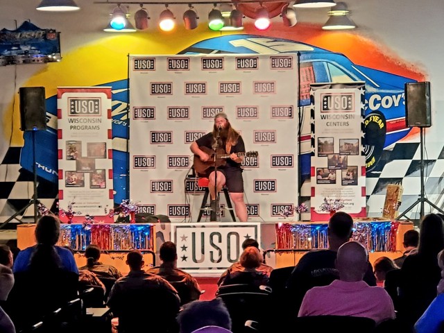 Artist Chris Kroeze sings a song June 15, 2021, during his 90-minute concert at Fort McCoy, Wis. He entertained dozens of audience members in McCoy's Community Center during a concert that was organized by Wisconsin USO and supported by the Fort...