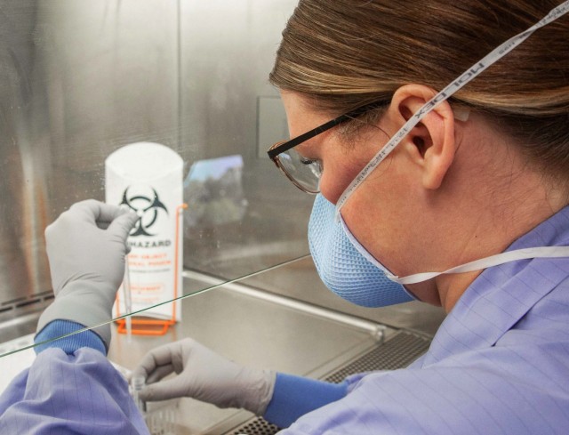 A laboratory technician prepares samples for testing.
