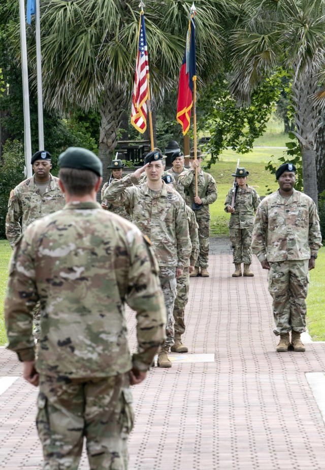 Maj.  Paul Selzer, commander of troops, salutes the 165th Infantry Brigade Command Col. Kent G. Solheim at the conclusion of the unit's change of command ceremony June 29 at Victory Field.