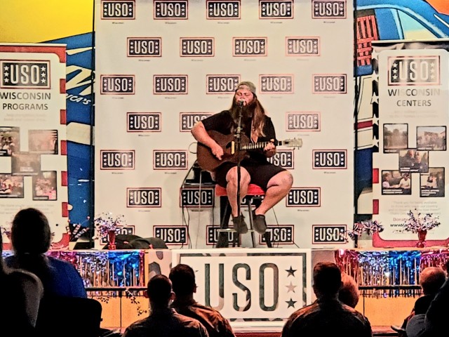 Artist Chris Kroeze sings a song June 15, 2021, during his 90-minute concert at Fort McCoy, Wis. He entertained dozens of audience members in McCoy's Community Center during a concert that was organized by Wisconsin USO and supported by the Fort...