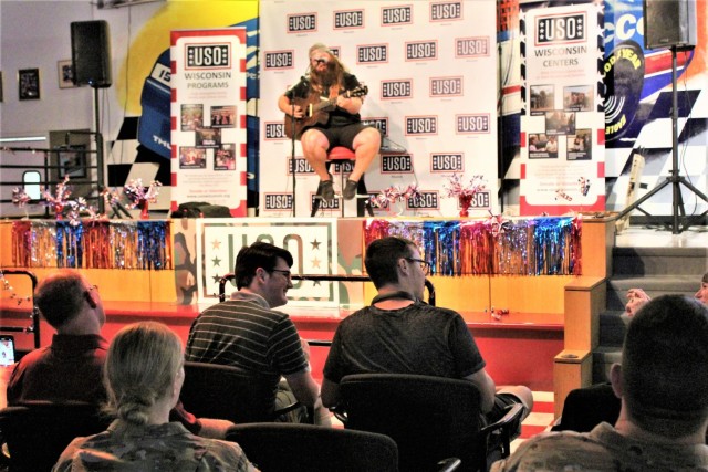 Artist Chris Kroeze sings a song June 15, 2021, during his 90-minute concert at Fort McCoy, Wis. He entertained dozens of audience members in McCoy's Community Center during a concert that was organized by Wisconsin USO and supported by the Fort...