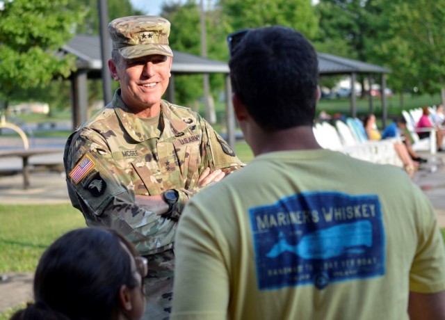 Major General JP McGee, commanding general of the 101st Airborne Division (Air Assault) and Fort Campbell, talks with Spc. Jacob White, 101st Aviation Regiment, 101st Combat Aviation Brigade, 101st Abn. Div., and his wife Farrell White about their...